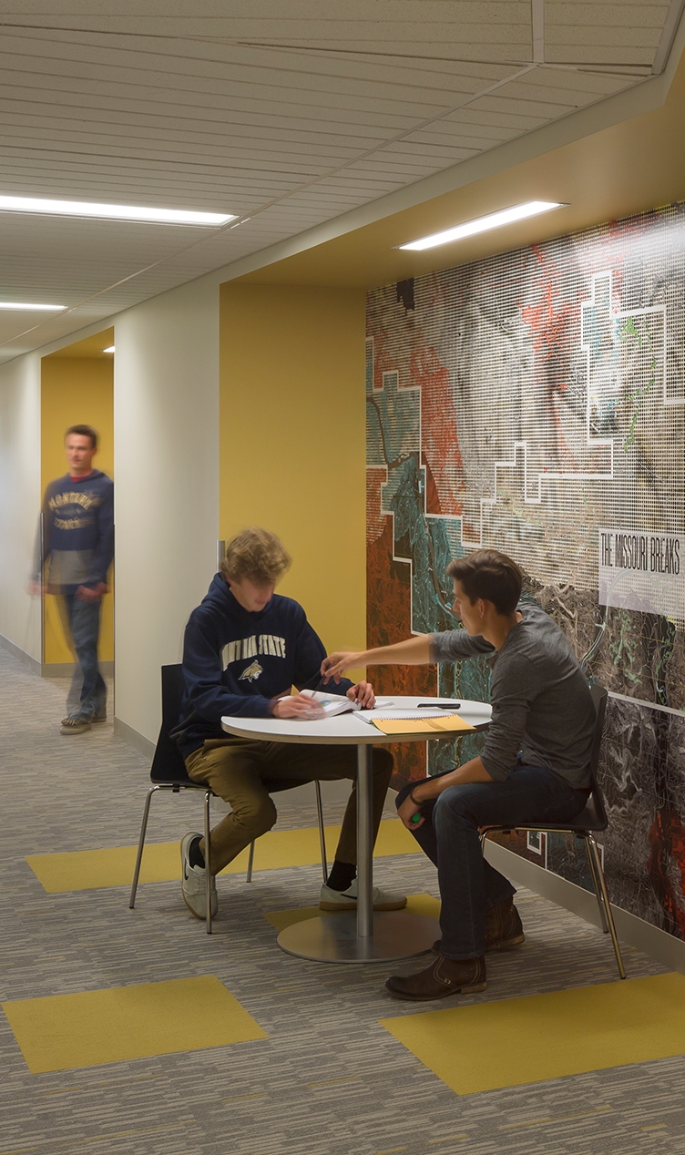 Wide corridors at Montana State University’s Yellowstone Hall provide additional spaces for students to study and collaborate, which helps break down the interior scale of the residential floors. — NAC Architecture