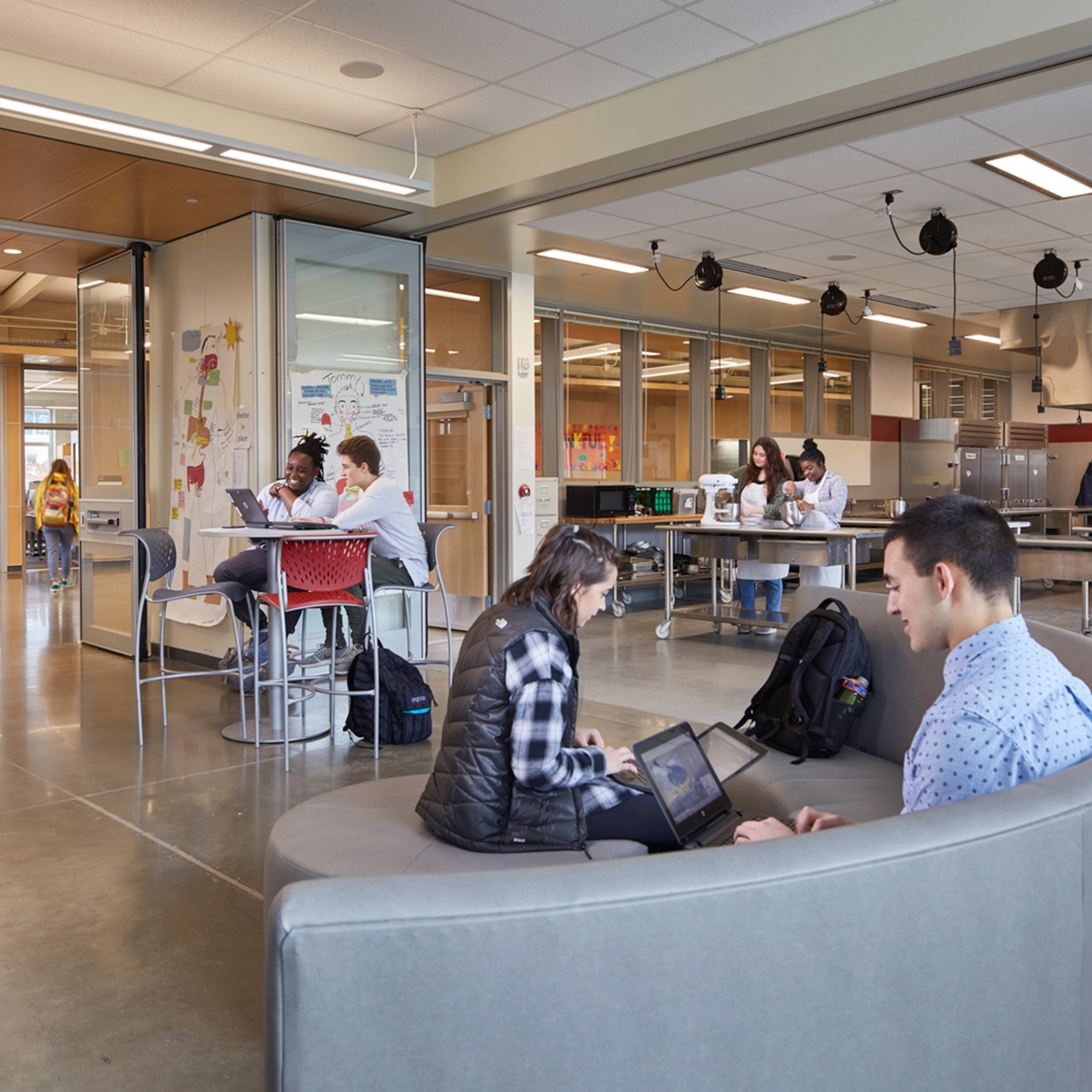 Flexible furniture which accommodates movement can increase boys’ attention span. Wilson High School — NAC Architecture