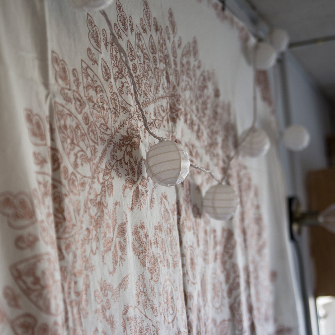 We used tapestries and warm lighting to celebrate Bailey’s “boho-chic” style.