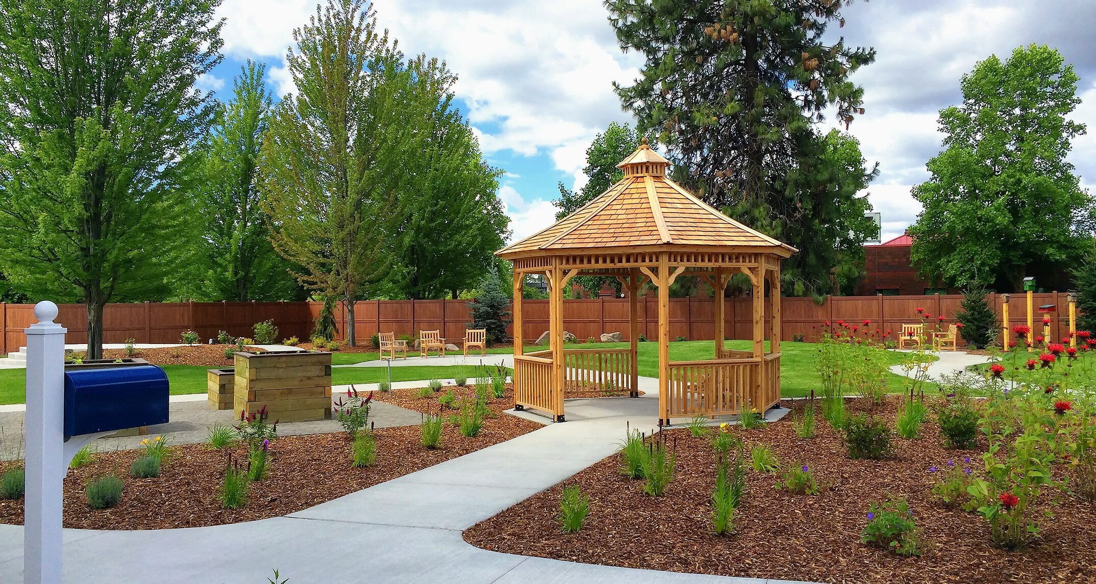 Outdoor seating, walking paths, raised planter beds, and
birdhouses provide a variety of passive and active ways for clients at the
Providence Adult Day Health Memory Garden to enjoy nature. Image courtesy of
SPVV Landscape Architects