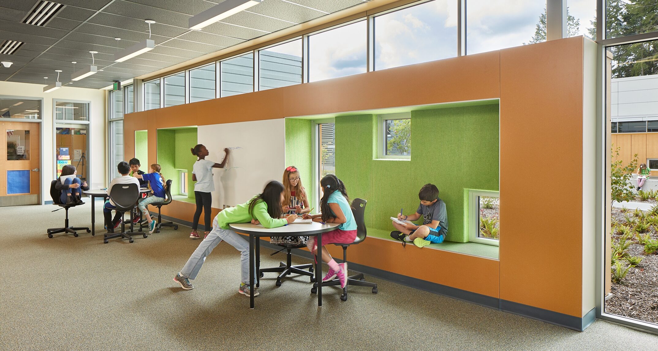 At Bennett Elementary School, open collaborative areas are strategically placed at the center of each classroom cluster to regulate access to highly-populated student spaces. A controlled entry system adds an additional layer of security to the building. – NAC Architecture