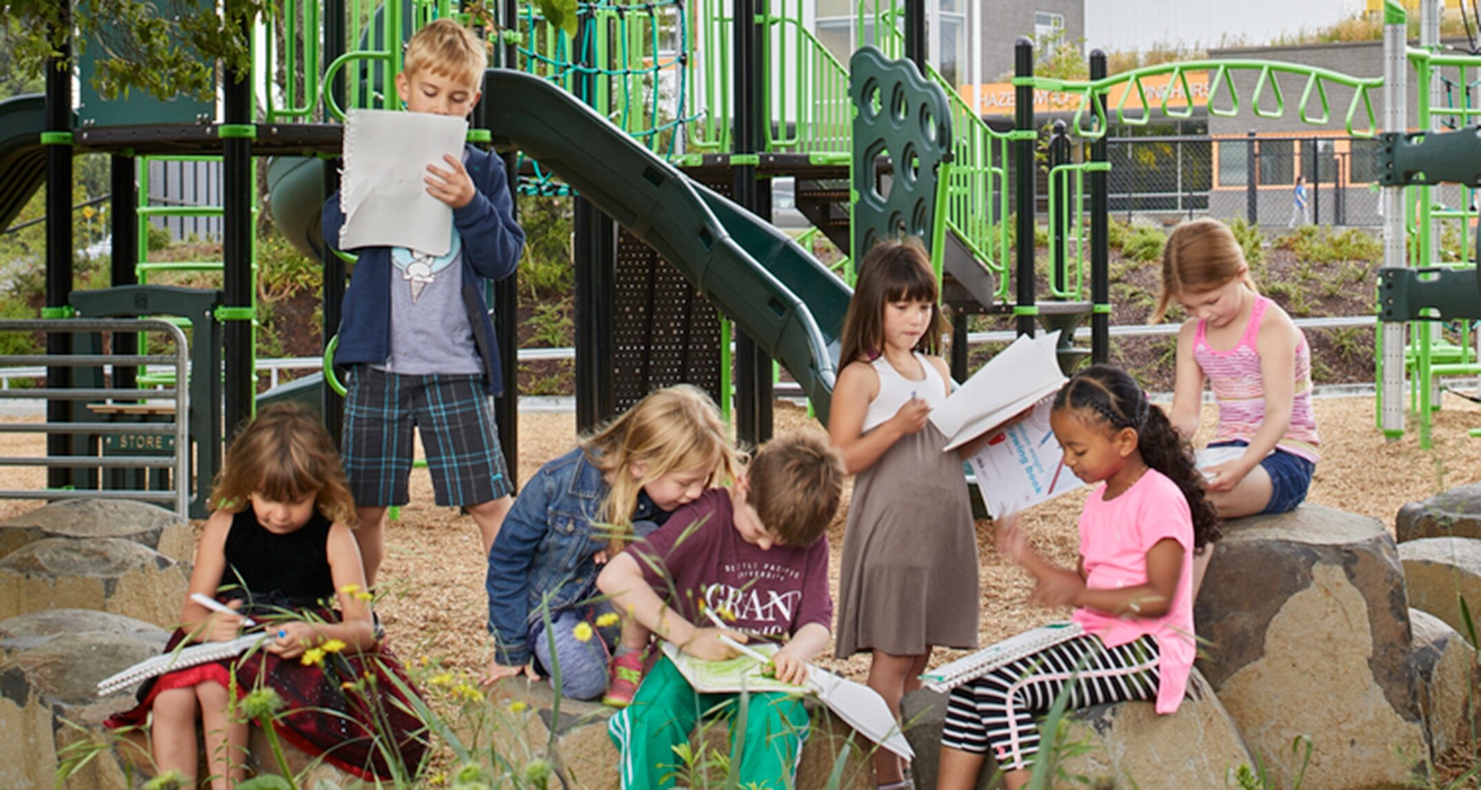 Students bring their science lesson outside with hands-on exploration of Hazel Wolf’s butterfly garden. - NAC