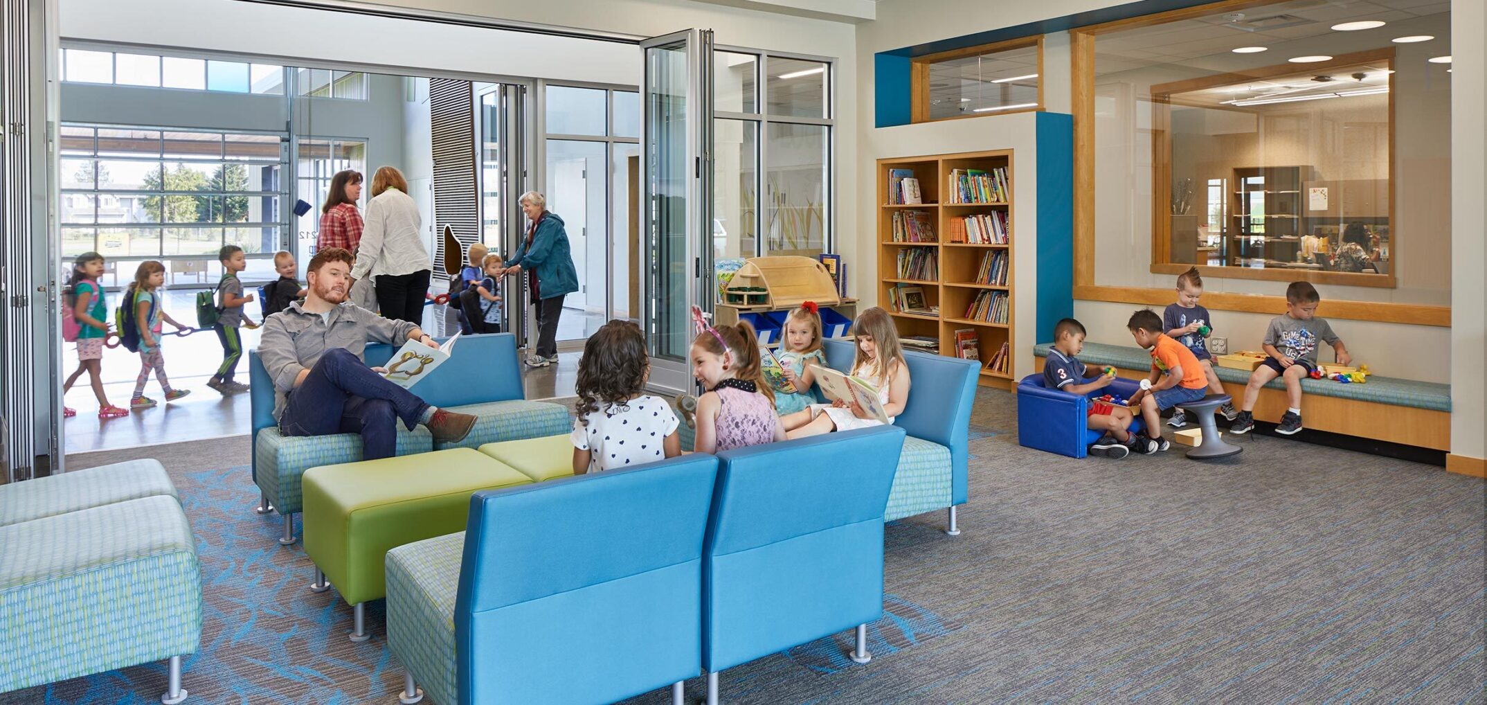 The community room at Lake Stevens Early Learning Center in Washington state provides family space with toys and books, along with comfortable seating and an area for meetings. - NAC